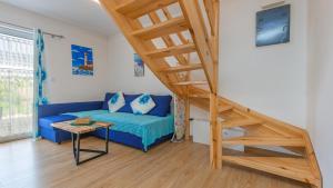 Televízia a/alebo spoločenská miestnosť v ubytovaní Apartamenty Sun & Snow Rumiankowa