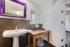 a bathroom with a sink and a mirror at La Guardiola in Riva del Garda +16 photos