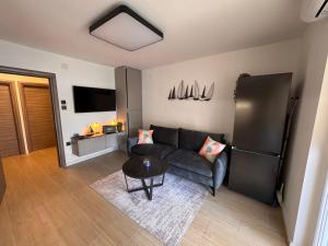 Televízia a/alebo spoločenská miestnosť v ubytovaní Apartments Jakobi by El-Pi Tours