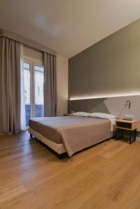 Posteľ alebo postele v izbe v ubytovaní Hotel Columbia