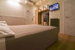 Posteľ alebo postele v izbe v ubytovaní Hotel Columbia