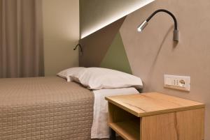 Posteľ alebo postele v izbe v ubytovaní Hotel Columbia