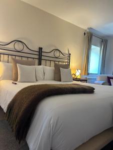 Postel nebo postele na pokoji v ubytování Corzo Hotel