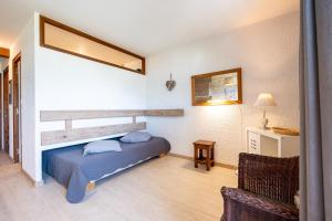 Una cama o camas en una habitación de Studio 14 - Charvin