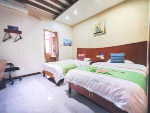 Letto o letti in una camera di A deer has you INN near by Tianmen Shan