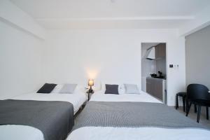 Postel nebo postele na pokoji v ubytování Junction Namba South Hotel Apartment ジャンクション難波南ホテルアパートメント + 37 fotografií