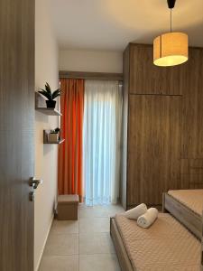 a bedroom with two beds and a window at Serenity in Kefalos