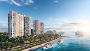 a city with tall buildings and boats in the water at Homestay Sapphire S2 Hạ Long - Tầng 25 - 31 - 2 phòng ngủ in Ha Long