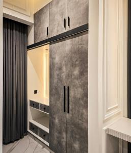 a dressing room with a large metal cabinet at The White Suites in Karachi