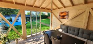 an inside view of a cabin with a large window at Fewo Traum in Neppermin