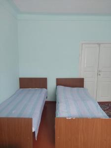 Postel nebo postele na pokoji v ubytování Ojakh