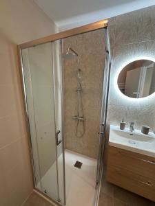 a bathroom with a shower and a sink at La parenthèse - 50 m de la plage in Saint-Hilaire-de-Riez