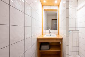 a bathroom with a sink and a mirror at Studio 9 - La Palettaz in Crest-Voland +17 photos