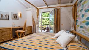 Postel nebo postele na pokoji v ubytování Locanda del Gabbiano - Acquappesa