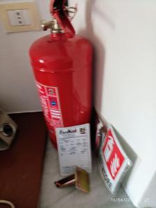 a red fire hydrant sitting on a counter next to at VILLALoddo2 sud Tertenia in Tertenìa