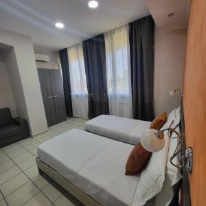 Postel nebo postele na pokoji v ubytování Mg Palace Hotel Costa del Sole