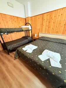 Letto o letti in una camera di Hotel Archimede Ortigia