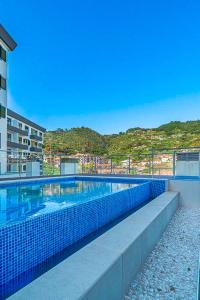 Bazén v ubytování Refúgio na Quinta Girassol nebo v jeho okolí