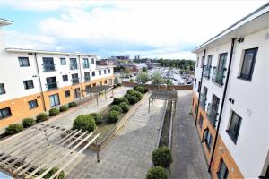 a view from the balcony of a building at 1 Bed Flat - Sleeps 4 - Pets - Parking - Wifi in Grays Thurrock +2 photos