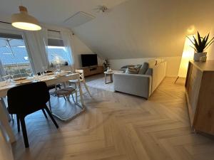 โทรทัศน์และ/หรือระบบความบันเทิงของ Nordwärts 53Grad Ferienwohnung in Burhave, Nordsee