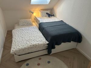 เตียงในห้องที่ Nordwärts 53Grad Ferienwohnung in Burhave, Nordsee +26 ภาพ