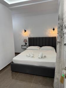 Postel nebo postele na pokoji v ubytování Hotel Vila AARON