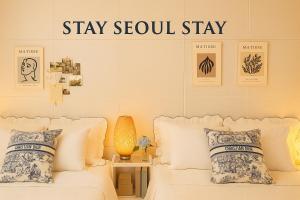 En eller flere senge i et værelse på Stay Seoul Stay