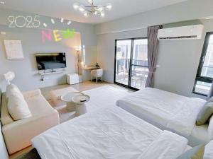 Cama ou camas em um quarto em Huayu Homestay