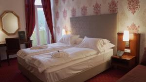 Krevet ili kreveti u jedinici u okviru objekta Hotel Kaiser Franz Josef