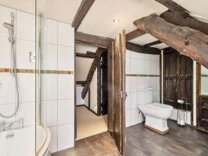 a bathroom with a toilet and a shower and a sink at The Old Church House in Newton Abbot +52 photos