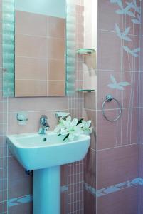 a bathroom with a sink and a mirror at Kerveli Luxury Villa in Kerveli