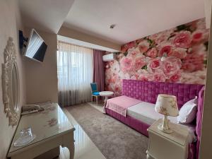 TV a/nebo společenská místnost v ubytování Hotel Dafi