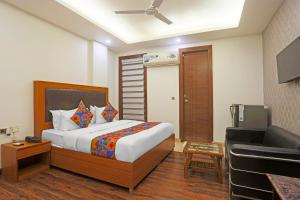 Postel nebo postele na pokoji v ubytování FabHotel Star Inn - Near Apollo Hospital