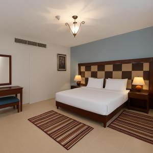 A bed or beds in a room at Marina Resort Port Ghalib, a member of Radisson Individuals