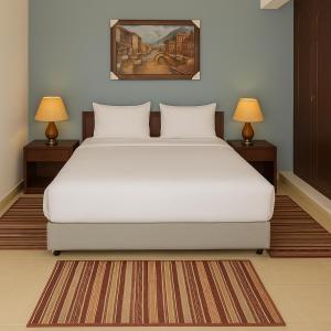 A bed or beds in a room at Marina Resort Port Ghalib, a member of Radisson Individuals