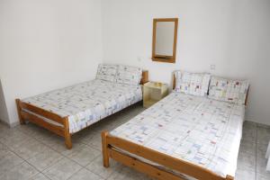 Postel nebo postele na pokoji v ubytování Flora Rooms