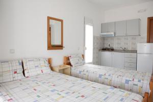 Postel nebo postele na pokoji v ubytování Flora Rooms