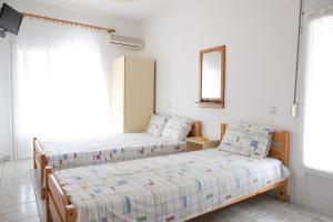Postel nebo postele na pokoji v ubytování Flora Rooms