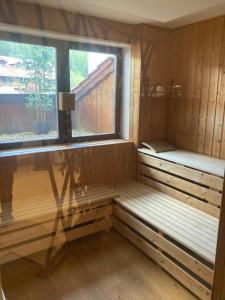 a sauna with two benches and a window at Pronájem pokoje v Bayerisch Eisenstein in Bayerisch Eisenstein +21 photos