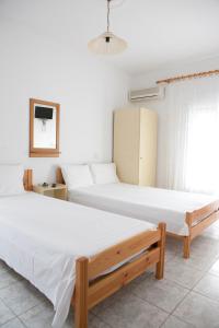 Postel nebo postele na pokoji v ubytování Flora Rooms