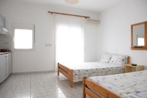 Postel nebo postele na pokoji v ubytování Flora Rooms