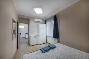 Posteľ alebo postele v izbe v ubytovaní Belvárosi Apartman