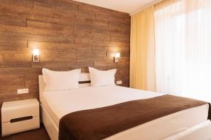 Postel nebo postele na pokoji v ubytování Hotel Dafi