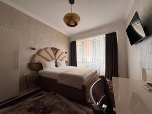 Postel nebo postele na pokoji v ubytování Hotel Dafi