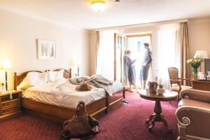 Postel nebo postele na pokoji v ubytování Cella Central Historic Boutique Hotel