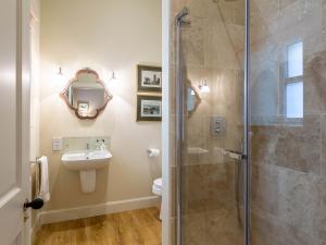 a bathroom with a shower and a toilet and a sink at 1 Bed in Forres 78430 in Forres +7 photos