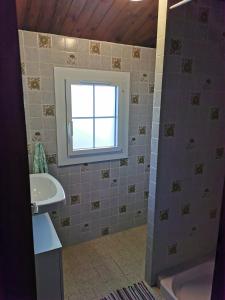 a bathroom with a sink and a tub and a window at La Villa in La Tranche-sur-Mer +17 photos