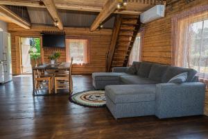 a living room with a couch and a table at Laudamaja in Vainupea