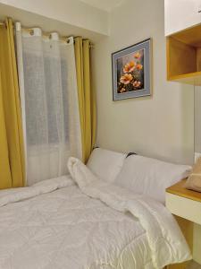 Ένα ή περισσότερα κρεβάτια σε δωμάτιο στο 2 Bed Room Cozy Condo Cebu +5 φωτογραφίες