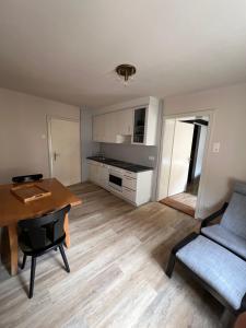 a living room with a table and a couch at Wohnung Albrecht Nummer 4 in Spalt